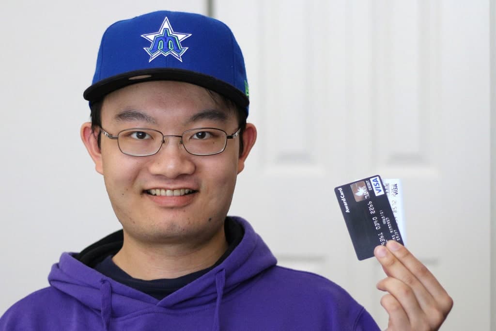 man with new credit card for debt consolidation loan